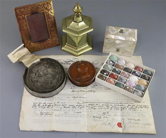 A group of assorted curios including a Thomas Carlisle brass commemorative casket,